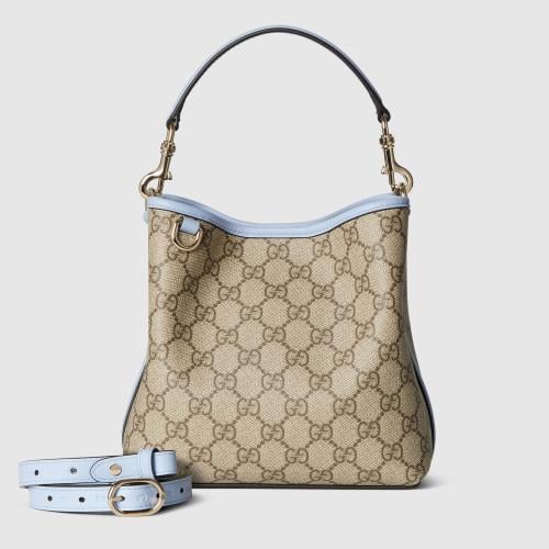 Gucci | GG Emblem small bucket bag | beige and dar...