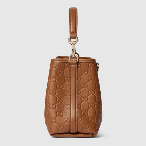 Gucci | GG Emblem small bucket bag | brown GG leat...