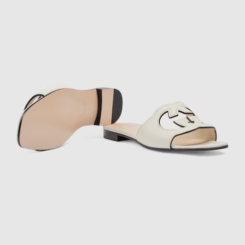 Gucci | Women's slide sandal with Interlocking G |...