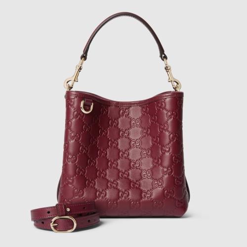 Gucci | GG Emblem small bucket bag | Rosso Ancora...