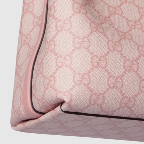 Gucci | GG Emblem small bucket bag | light pink co...