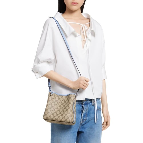Gucci | GG Emblem small bucket bag | beige and dar...
