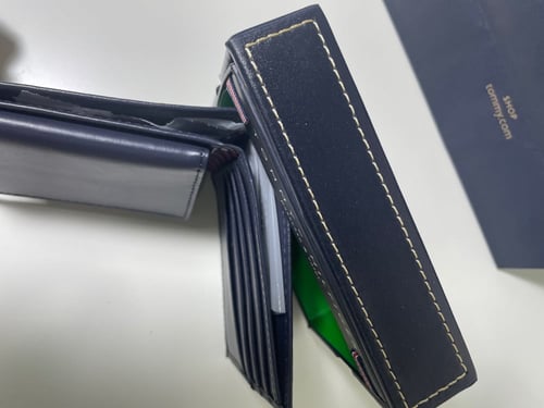 محفظه تومي كحلي