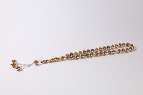 سبحة قفص 33 حبة بيضاوي مع كهرمان