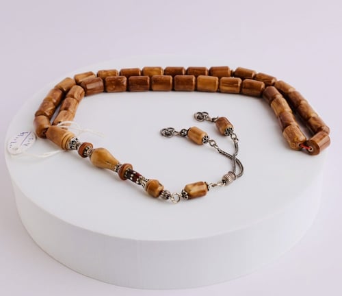 سبحة كوك 12 ملم بامام متميز من الفضة 33 حبة