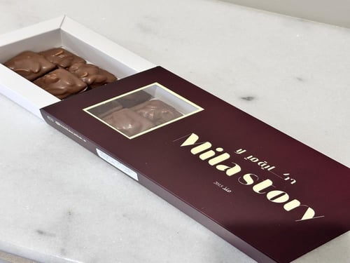 سنيكرس حكاية ميلا