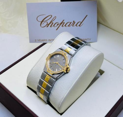 ساعة شوبارد ذهبي وفضي بإطار رمادي شامل الملحقات