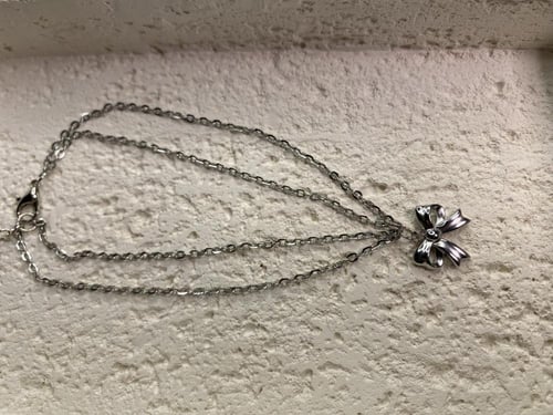 خلخال فضي مع فيونكة (0014)