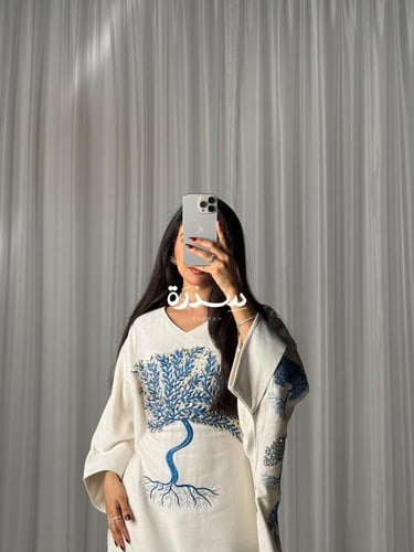 جلابية لينن مطرزة برنت بالخلف