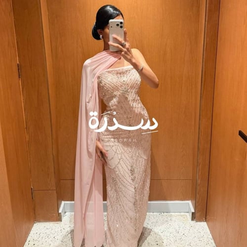 فستان سهرة مرصع بالكامل بالخرز و اللؤلؤ