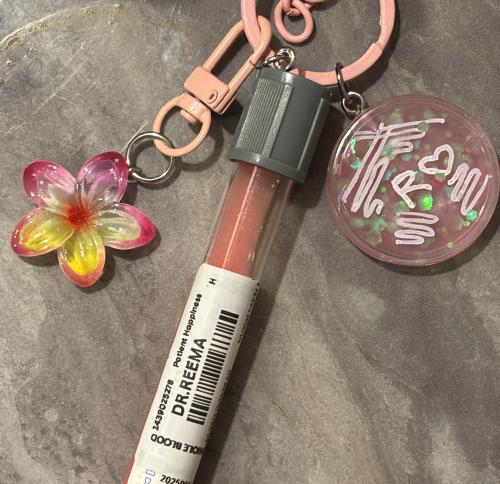 Pink glitter with gray test tube flower and pink a...