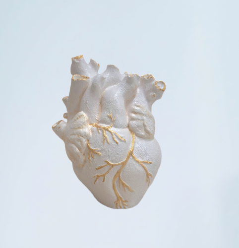 Full-size model of a white and gold heart