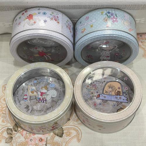 عرض مؤقت لمجموعة اربع علب معدنية دائرية