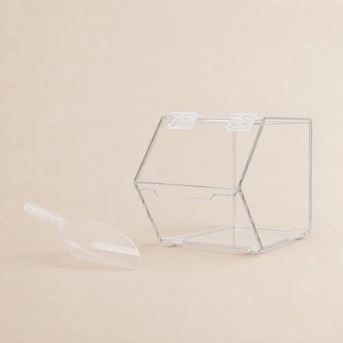 Acrylic box with a large plastic spoon