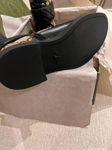 Luxurious brown Gucci boots with GG beige logo and...