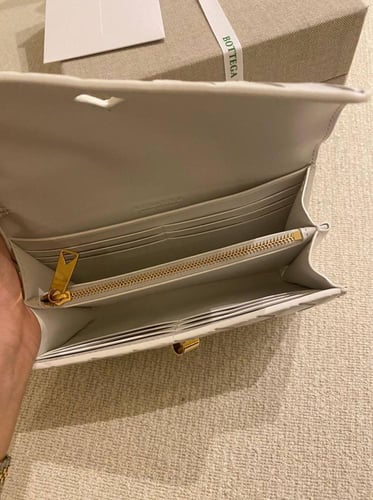 Botte Long clutch with top handle in braided leath...