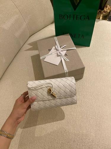 Botte Long clutch with top handle in braided leath...