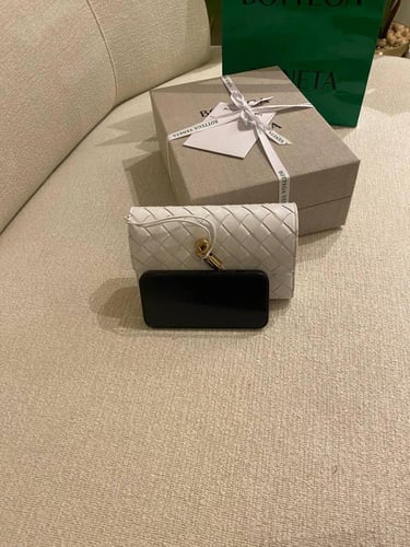 Botte Long clutch with top handle in braided leath...