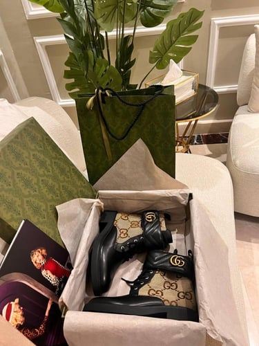 Luxurious brown Gucci boots with GG beige logo and...