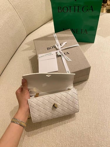 Botte Long clutch with top handle in braided leath...