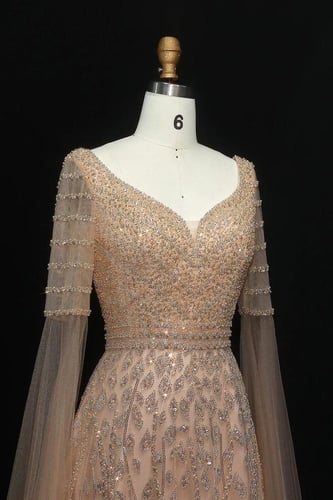 فستان شك ذهبي مع اكمام كيب