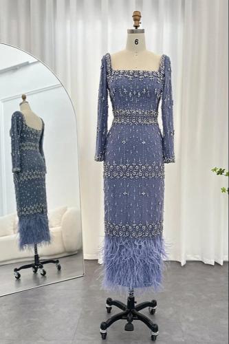 فستان ازرق شك يدوي مع ريش