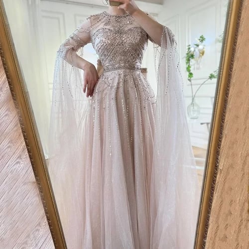 فساتين سهرة نسائية بلون أزرق هادئ على شكل تلة واحد...