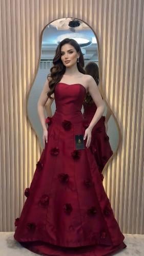 A red dress with elegant and sophisticated flowers
