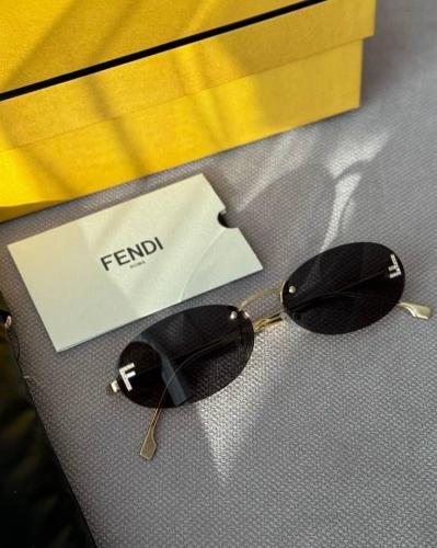 Fendi oval glasses with a gold frame and lenses