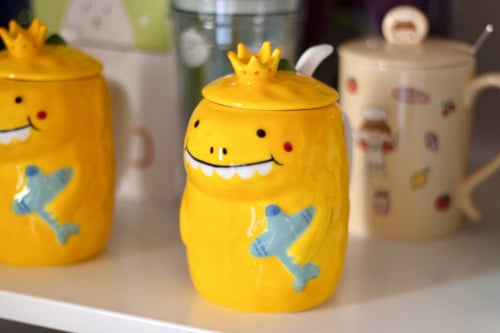 A nice cup with lid and spoon
