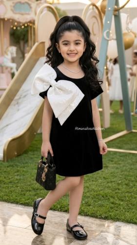 My daughter's velvet dress elegant with a white bow on the shoulder