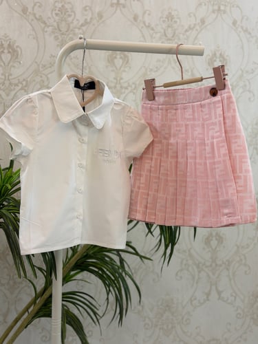 تيور بناتي من قطعتين وتنورة بكسرات جميله ومرتبه