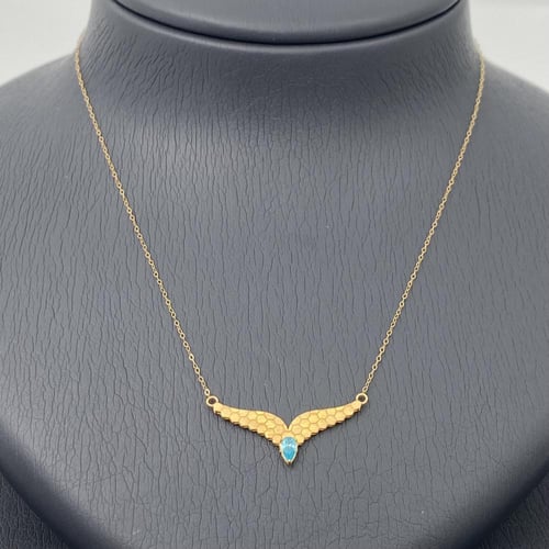 طقم جناح الصقر ذهب عيار 21 وزن 3.13 جم بفص أزرق جذ...