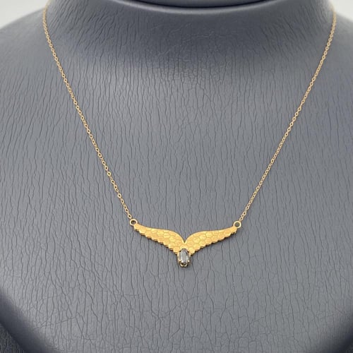 طقم جناح الصقر ذهب عيار 21 وزن 3.55 جم مزين بفص أس...