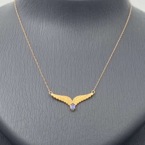 طقم جناح الصقر ذهب عيار 21 وزن 3.59 جم بفص ازرق را...