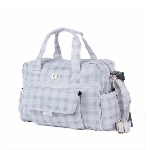 شنطة تغيير بخطوط مربعة