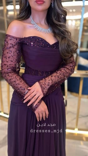 فستان حور أكمام طويله مطرزه ع التُل بنفس تطريز الخ...