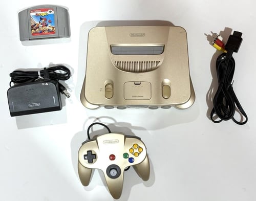 جهاز نتيندو 64 الذهبي بالكرتون - Nintendo 64 gold