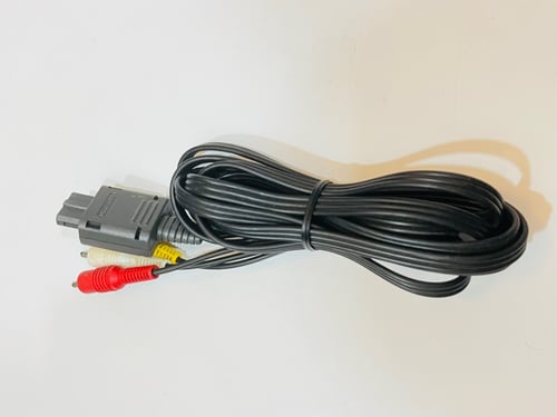 جهاز نتيندو 64 الذهبي بالكرتون - Nintendo 64 gold