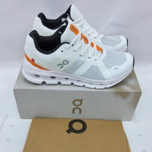 حذاء أون رننق الرياضي – أبيض ورمادي بلمسات برتقالي...