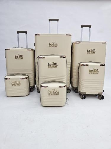 طقم شنط سفر 7 قطع قابل للتوسعة بتصميم COACH – أوف...