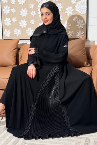 Luxurious black abaya with side pleats and decorated with a braided chain trim