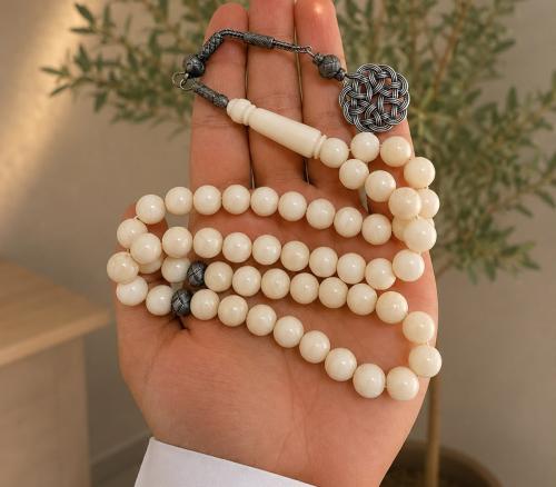 مسباح بكلايت 10 ملي 51 خرزه بفواصل فضه و طربزونه ش...