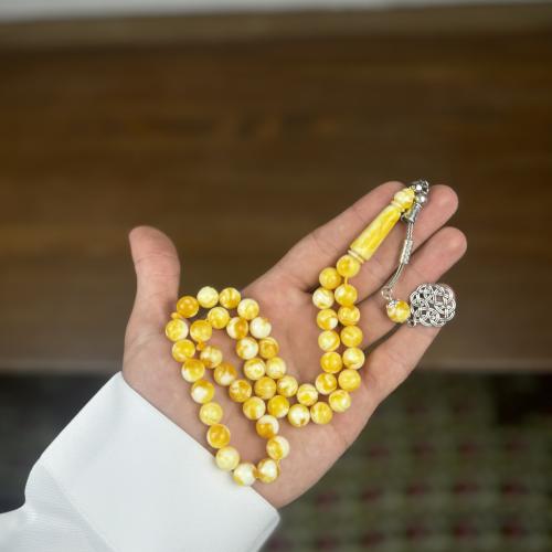 سبحة بكلايت اصفر معجن ابيض