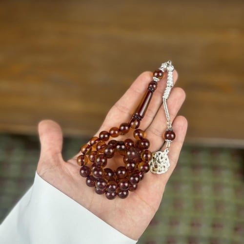 سبحة بكلايت عسلي بعرق احمر