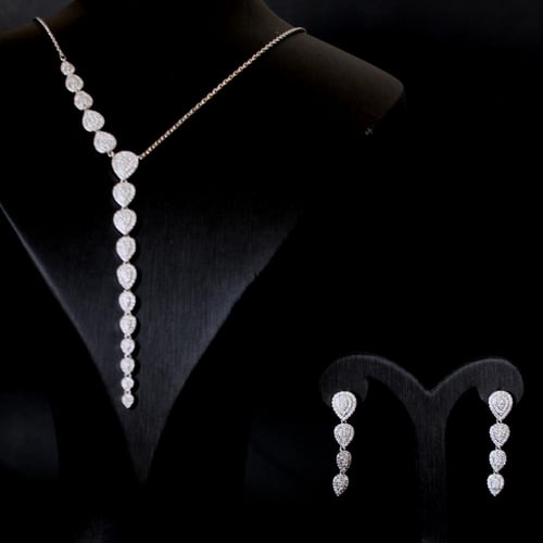 طقم فضي بسلسال نازل وحلق زركون مطلي روديوم – نعومة...