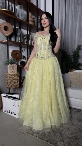 Luxurious lemon evening dress with a royal cut and royal embroidery