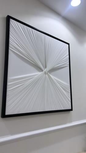 Canvas painting in off-white color, size 100*100, with a black frame