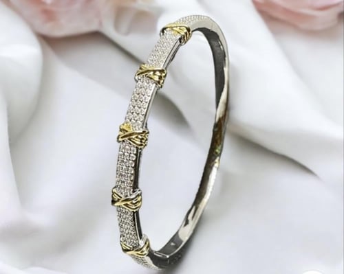 إسوارة تيتانيومى صلب بتصميم شكل XO لون فضي مع ذهبي