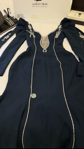 Crepe dress with shawls from the back and embellis...